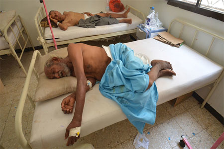 People infected with cholera lie on beds at a hospital in the Red Sea port city of Hodeidah, Yemen May 14, 2017.
