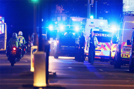 Police attend to an incident near London Bridge in London, Britain, June 3, 2017