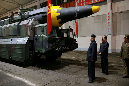 North Korean leader Kim Jong Un inspects the long-range strategic ballistic rocket Hwasong-12
