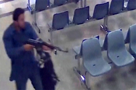 A gunman entering Iranian parliament building June 7, 2017, Tehran, Iran.