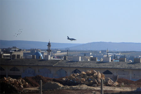 A warplane lands in Aleppo, Syria