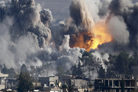 Smoke rises over Syrian town of Kobani after an airstrike. A U.S.-led military coalition has been bombing Islamic State