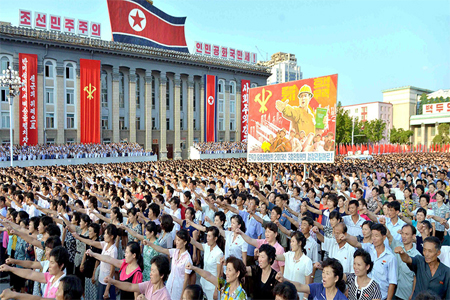 People participate in a Pyongyang city mass rally held at Kim Il Sung Square on August 9, 2017