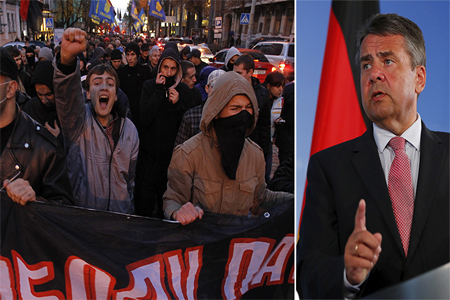 Activists of Ukrainian nationalist party (L), German Foreign Minister Sigmar Gabriel (R