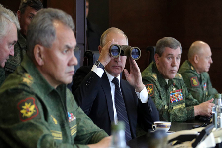 President Vladimir Putin seen while surveying the Russia and Belarus Union State armed forces activities at the main stage of the joint strategic exercises "Zapad-2017" on the Luzhsky range, September 18, 2017.