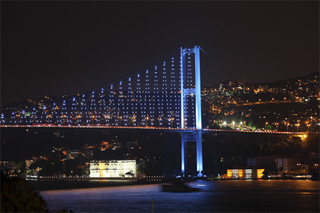The Bosphorus Bridge that links the city's European and Asian sides is illuminated in Istanbul