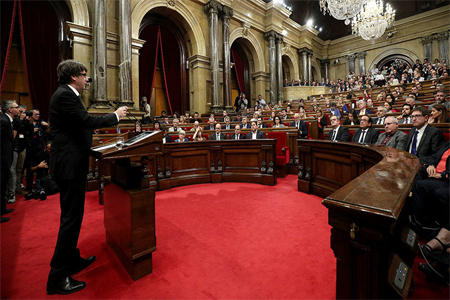 Catalan President Carles Puigdemont speaks in the chamber at the Catalonian regional parliament in Barcelona, Spain, October 10, 2017.