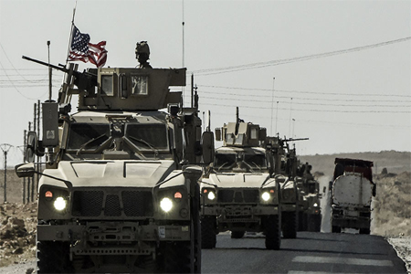 A US military convoy drives on a highway from Kobane to Ain Issa on September 29, 2017.