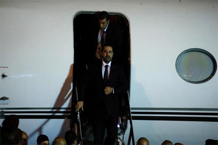 Saad al-Hariri, who announced his resignation as Lebanon's prime minister from Saudi Arabia, walks down the steps of an airplance at Beirut's international airport, in Beirut. (Reuters)