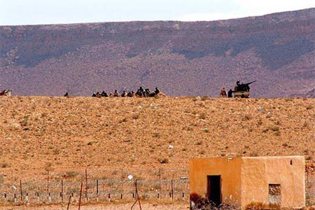 Armed groups clashed Friday in western Libya, forcing the closure of a key border crossing with Tunisia.