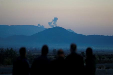 Smoke rises from the Syria's Afrin region, as it is pictured from near the Turkish town of Hassa, on the Turkish-Syrian border in Hatay province.
