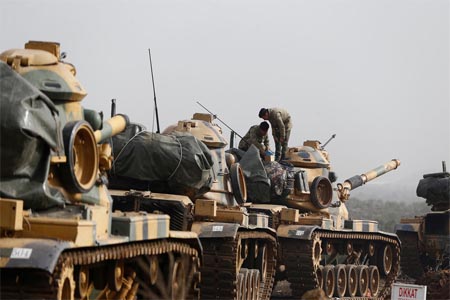 Turkish tanks cross into the Kurdish enclave of Afrin in Syria on January 22.