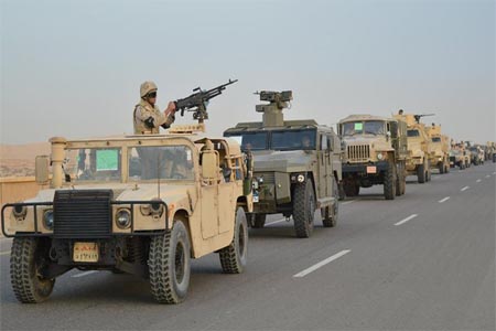 Egyptian Army's Armoured Vehicles are seen on a highway to North Sinai during a launch of a major assault against militants