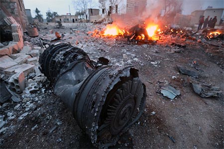 A picture taken on February 3, 2018, shows smoke billowing from the site of a downed Sukhoi-25 fighter jet in Syria's northwest province of Idlib