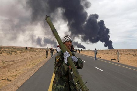A rebel holds a man-portable air-defense system during clashes in Syria in 2011