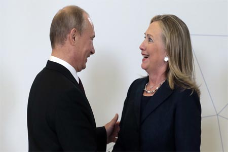 Vladimir Putin meets former US Secretary of State Hillary Clinton at the APEC summit on September 8, 2012