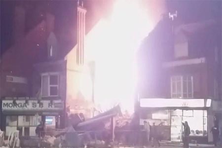 Flames leap into the sky from the site of an explosion in Leicester.