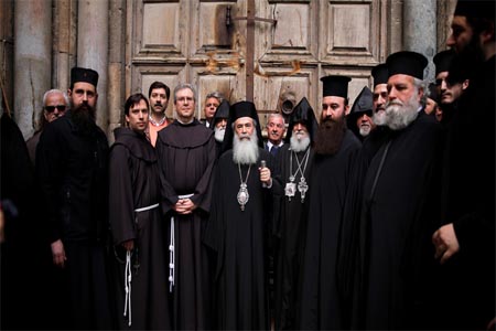 Church leaders stand during a news conference in front of the closed doors of the Church of the Holy Sepulchre in Jerusalem's Old City.