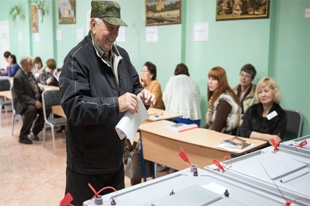 Voter at a polling station in Omsk, Siberia