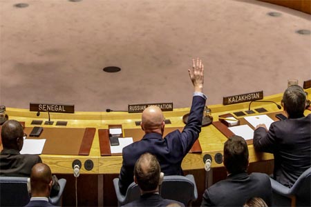 Russian Ambassador to the United Nations Vasily Nebenzya votesduring a meeting of the UN Security Council.