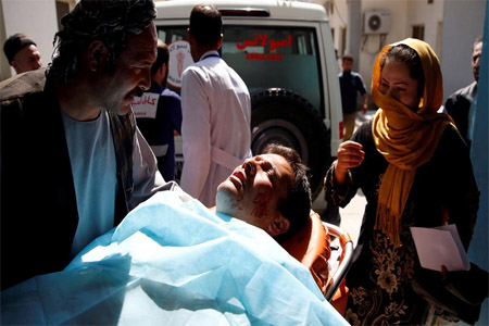An injured person is seen in a hospital after a blast in Kabul on March 21, 2018.