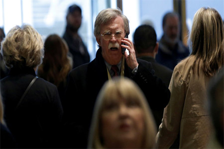 Former US Ambassador to the United Nations John Bolton speaks on a mobile phone as he arrives for a meeting with US President-elect Donald Trump at Trump Tower in New York, U.S., December 2, 2016.
