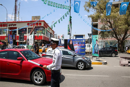 Banners and flags for candidates and lists for the elections hang along a street in the oil-rich and multi-ethnic northern city of Kirkuk.
