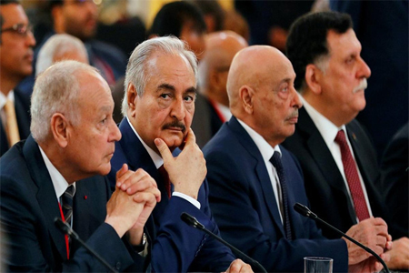 Khalifa Haftar, Aguila Saleh Issa and Libyan Prime Minister Fayez al-Sarraj during an international conference on Libya at the Elysee Palace in Paris.
