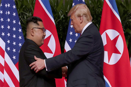 US President Donald Trump shakes hands with North Korean leader Kim Jong Un at the Capella Hotel on Sentosa island in Singapore.