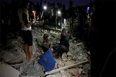People react at the site of a car bomb attack in Sadr City district of Baghdad.