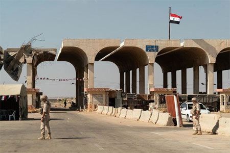 Members of the Russian military police patrol the Nassib border crossing with Jordan in the southern Syrian province of Daraa a on August 14, 2018. (AFP)