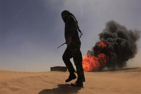 A security officer walks past a gas pipeline after an explosion in Libya. (File photo: Reuters)