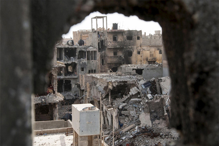 Damaged buildings are pictured after clashes between forces in Benghazi. (File photo: Reuters)