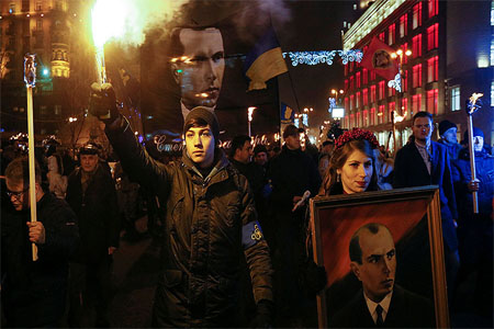 Activists of the Svoboda (Freedom) Ukrainian nationalist party hold flrares and torches as they take part in a rally to mark the 108th birth anniversary of Stepan Bandera, one of the founders of the Organization of Ukrainian Nationalists (OUN), in Kiev, Ukraine, January 1, 2017.