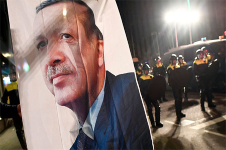 Turkish President Recep Tayyip Erdogan's image during protests in Rotterdam, Netherlands March 11, 2017.
