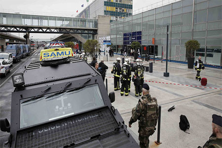 Military and emergency services outside Orly airport southern terminal after shooting incident near Paris