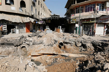 FILE PHOTO: A crater made by an airstrike against Islamic State militants, Mosul, Iraq.