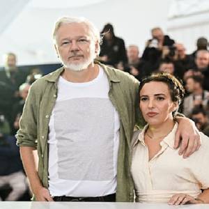 Cannes Festival. Assange wears a T-shirt with the names of some 5,000 children killed in Gaza